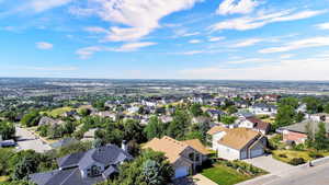 Expansive aerial perspective showcasing a residential area with a far-reaching horizon