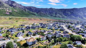 Residential community with diverse architectural styles, featuring established landscaping and paved roadways