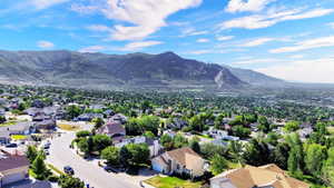 Expansive residential area featuring numerous single-family homes with diverse architectural styles, mature landscaping, and winding streets