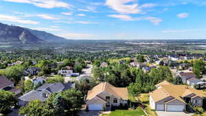 Residential neighborhood featuring a variety of single-family homes with pitched roofs and attached garages
