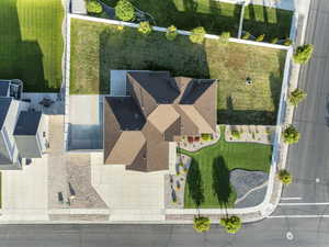 Single-story residence featuring a brown shingle roof, concrete driveway, and an attached two-car garage