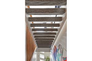 Staircase with carpeted treads and open risers