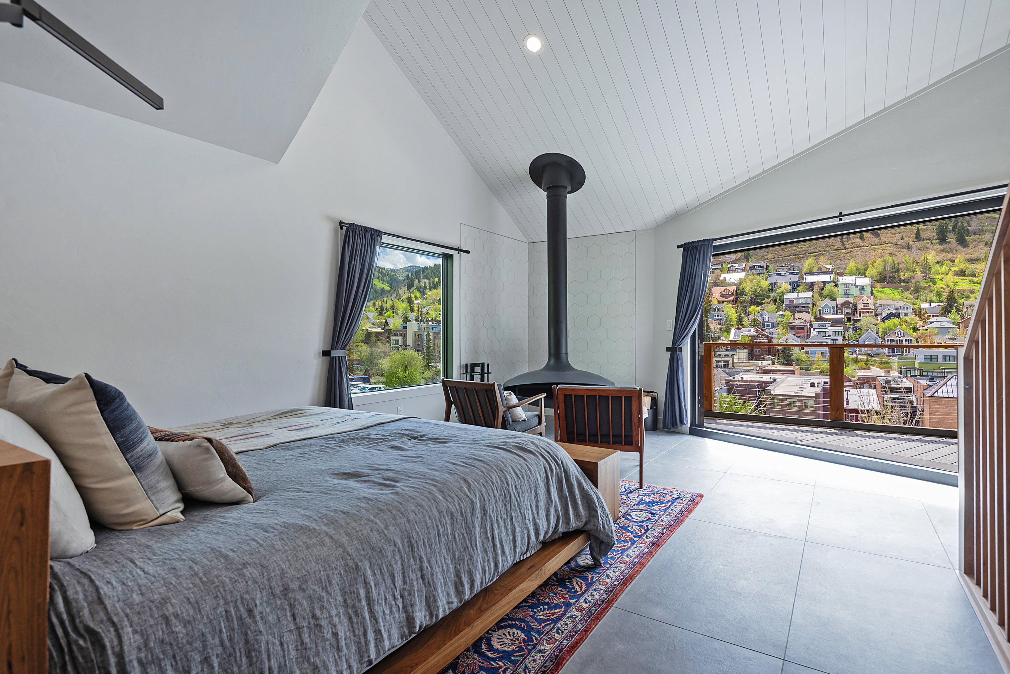 Vaulted ceiling with white paneling and recessed lighting