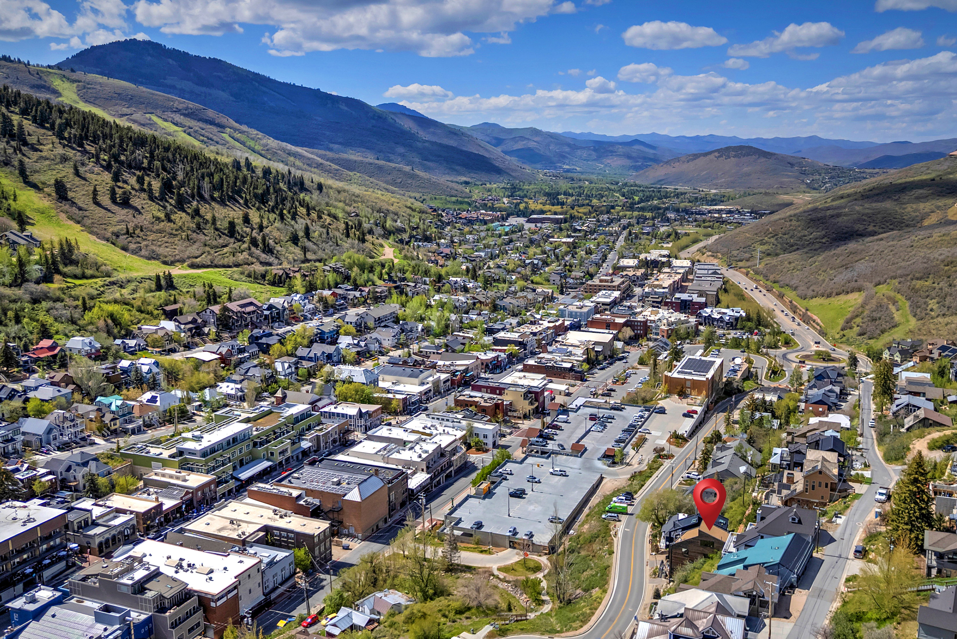Aerial perspective highlighting a property within a mountain valley setting
