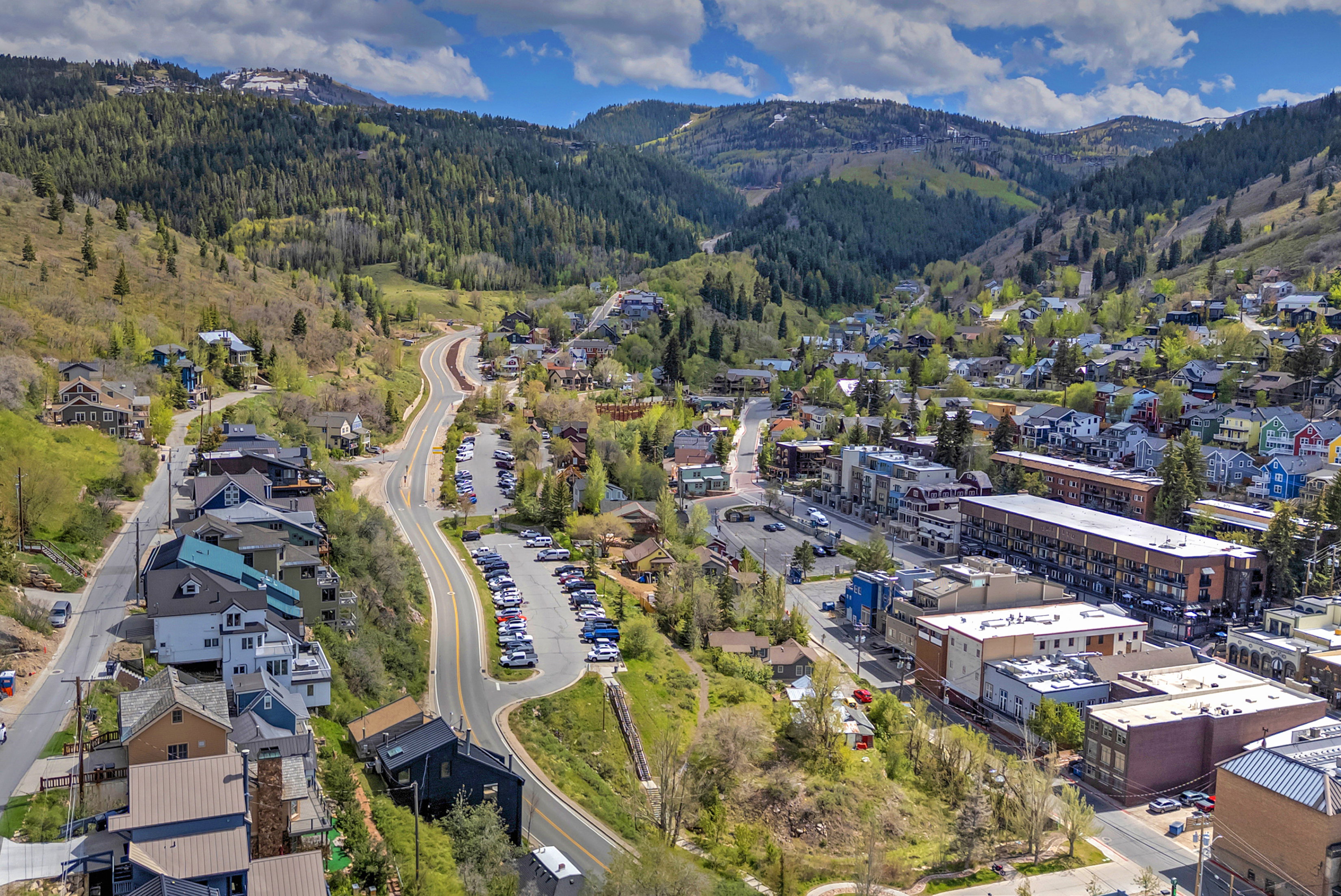 Mountain community featuring diverse architectural styles, winding roads, and extensive green spaces