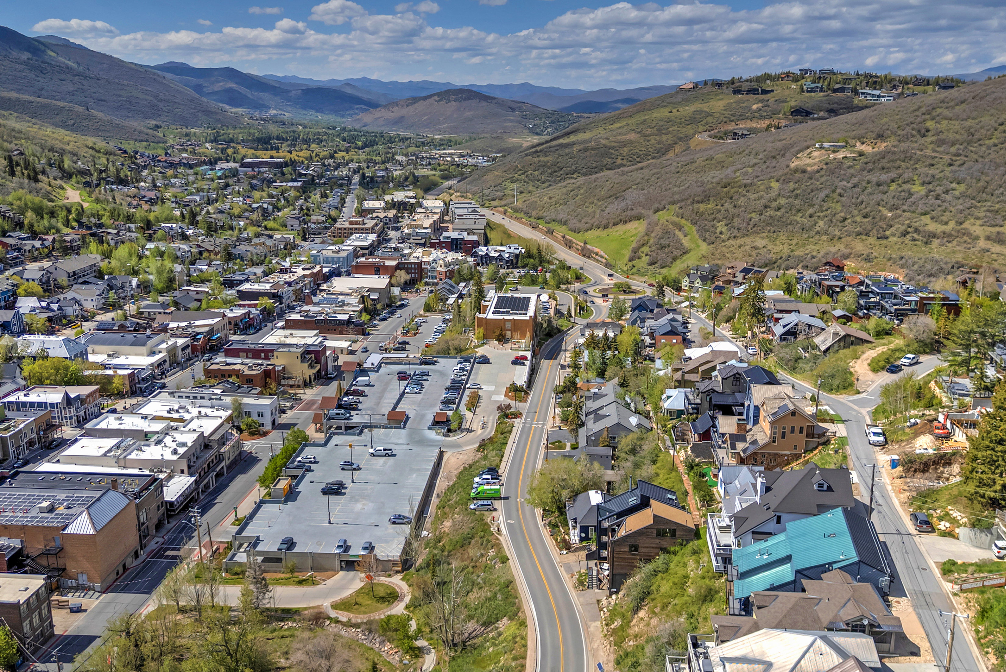 Aerial perspective of a mountain town featuring commercial and residential structures
