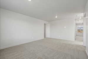 **Disclaimer**  Interior package may vary. Spacious room featuring new carpeting, freshly painted walls, recessed lighting, and white trim
