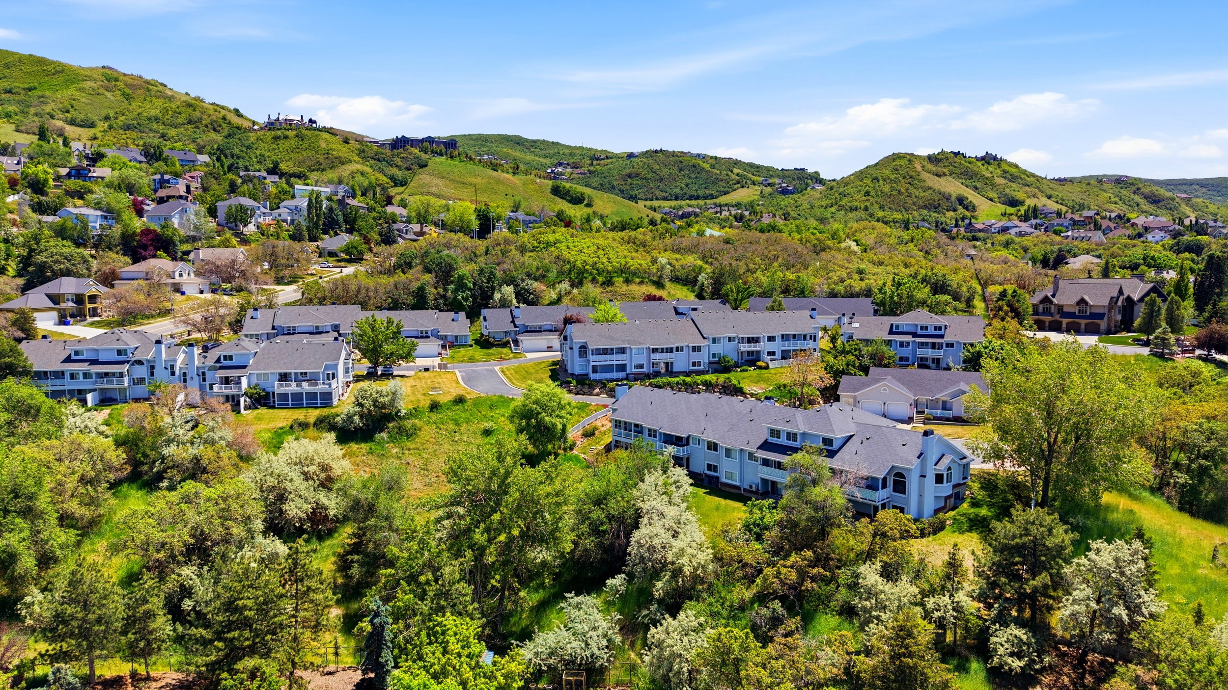 Residential community with multi-story buildings and dark roofs