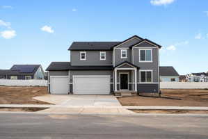 Modern two-story residence with gray siding and white trim