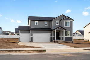 Contemporary two-story residence featuring gray siding with white trim accents