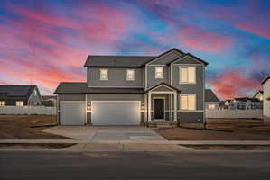 Contemporary two-story residence with gray siding and white trim accents