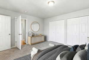 Interior room featuring carpet flooring and light gray walls