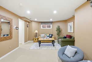 Recreational room featuring recessed lighting, a window with blinds, and neutral wall tones