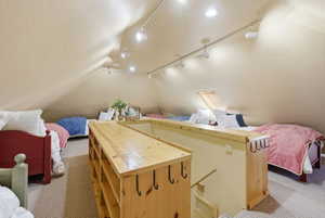 Spacious attic conversion with vaulted ceilings and recessed lighting