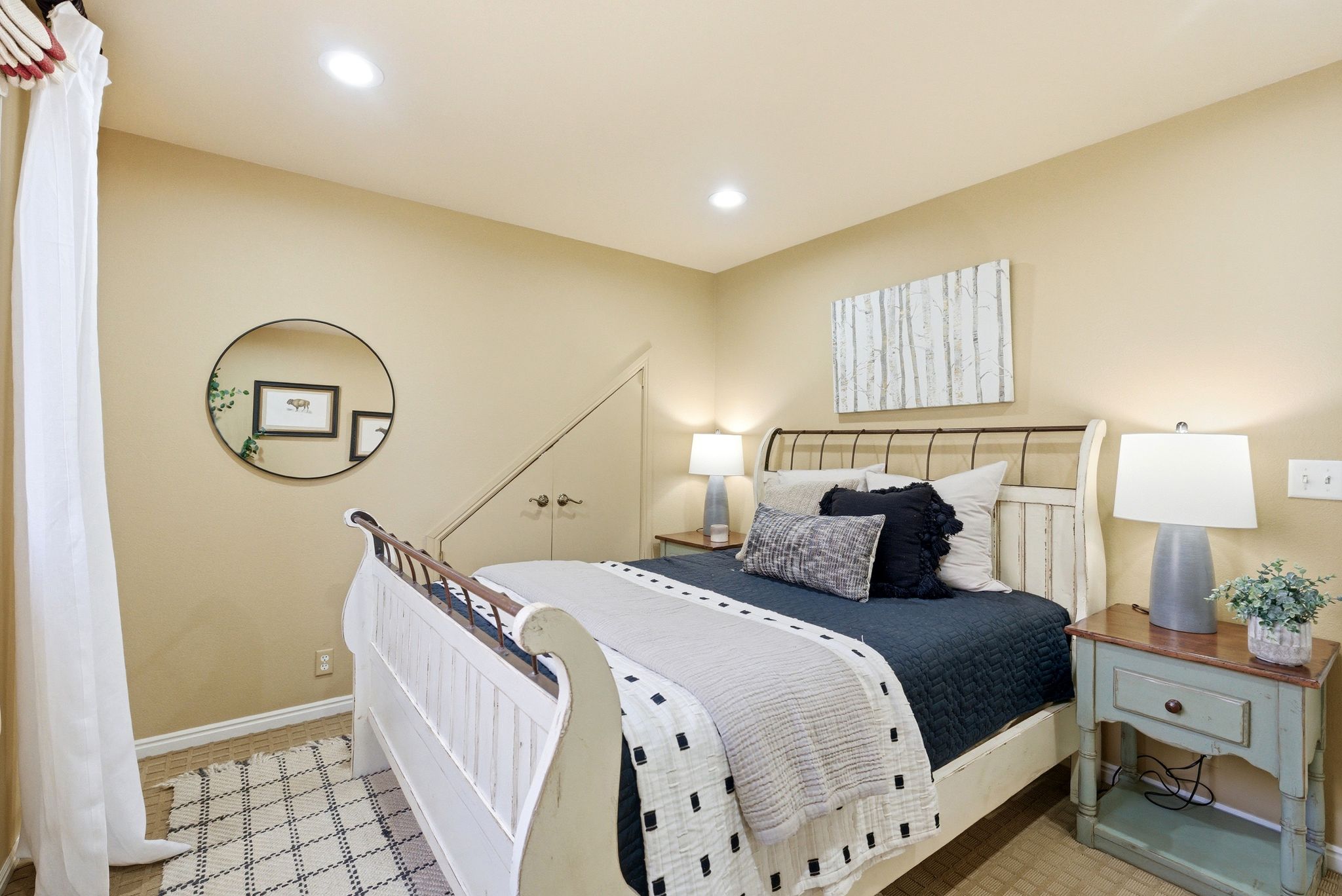 Bedroom featuring recessed lighting, a built-in closet with double doors, and beige wall tones