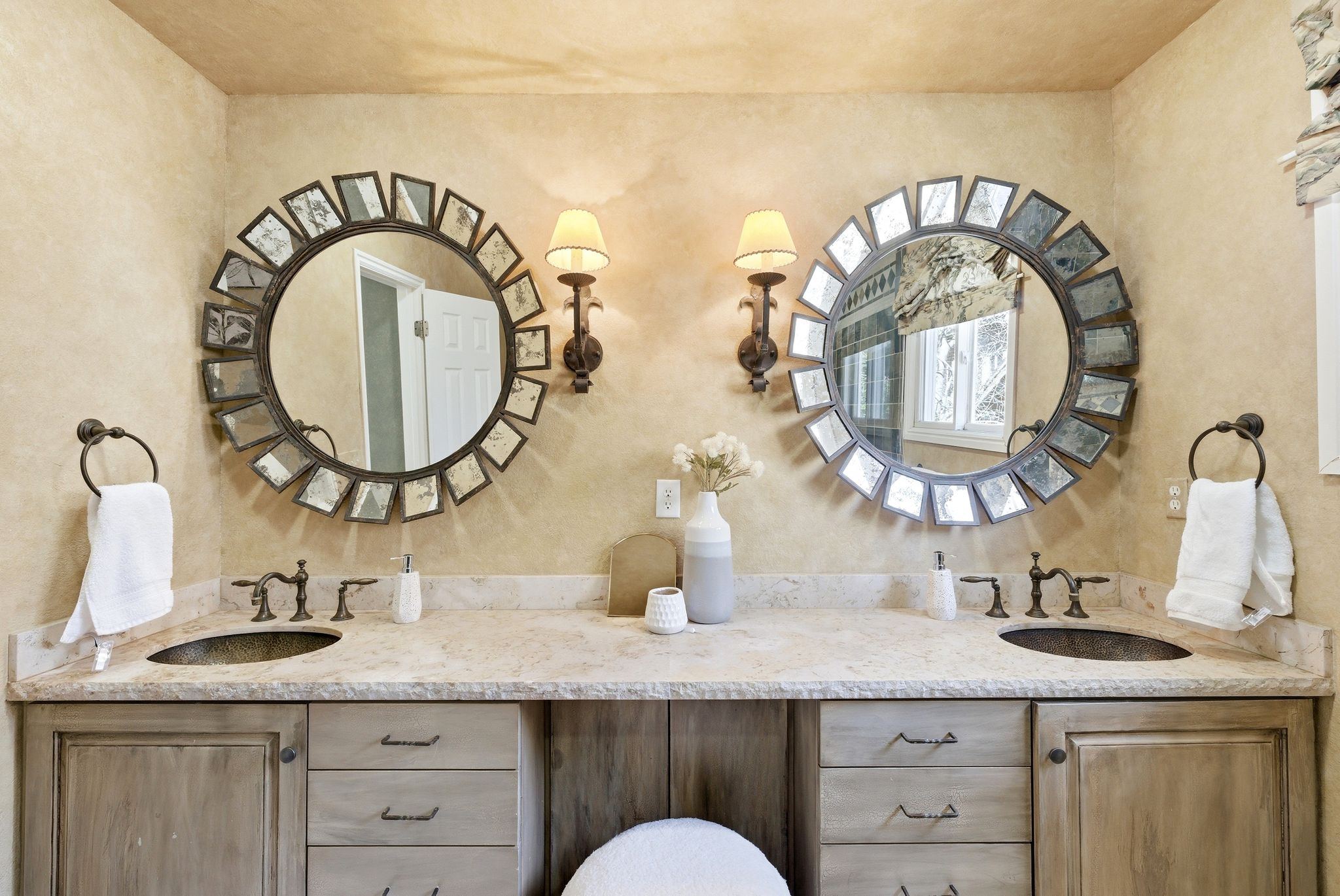 Dual vanity featuring integrated sinks, a light-toned countertop, and dark-toned hardware