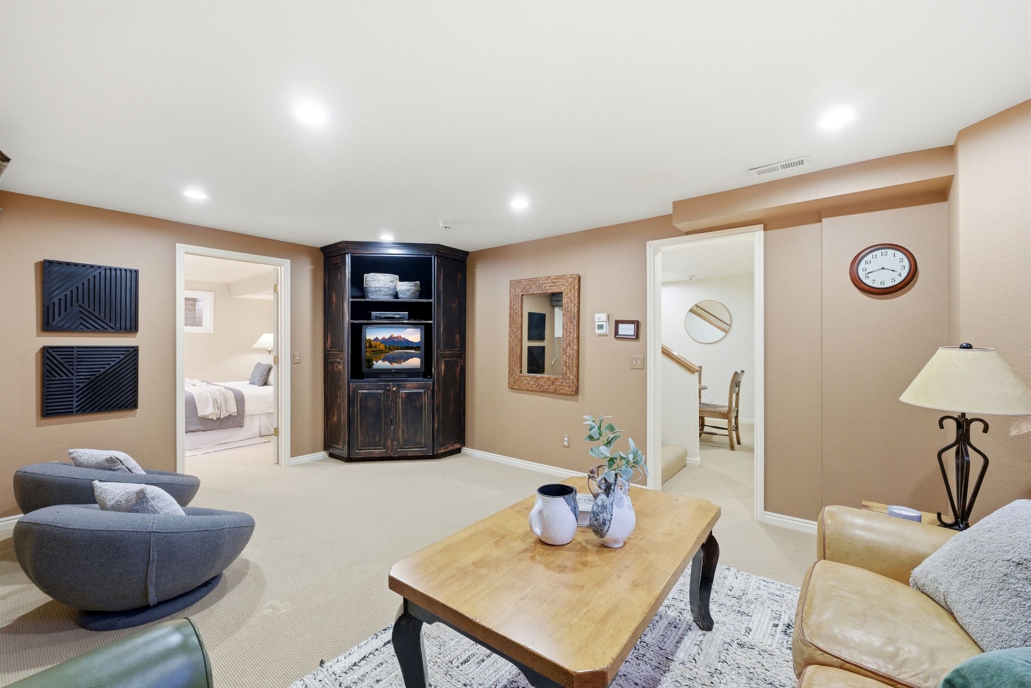 Spacious secondary living area featuring recessed lighting, plush carpeting, a built-in media cabinet, and light-toned walls