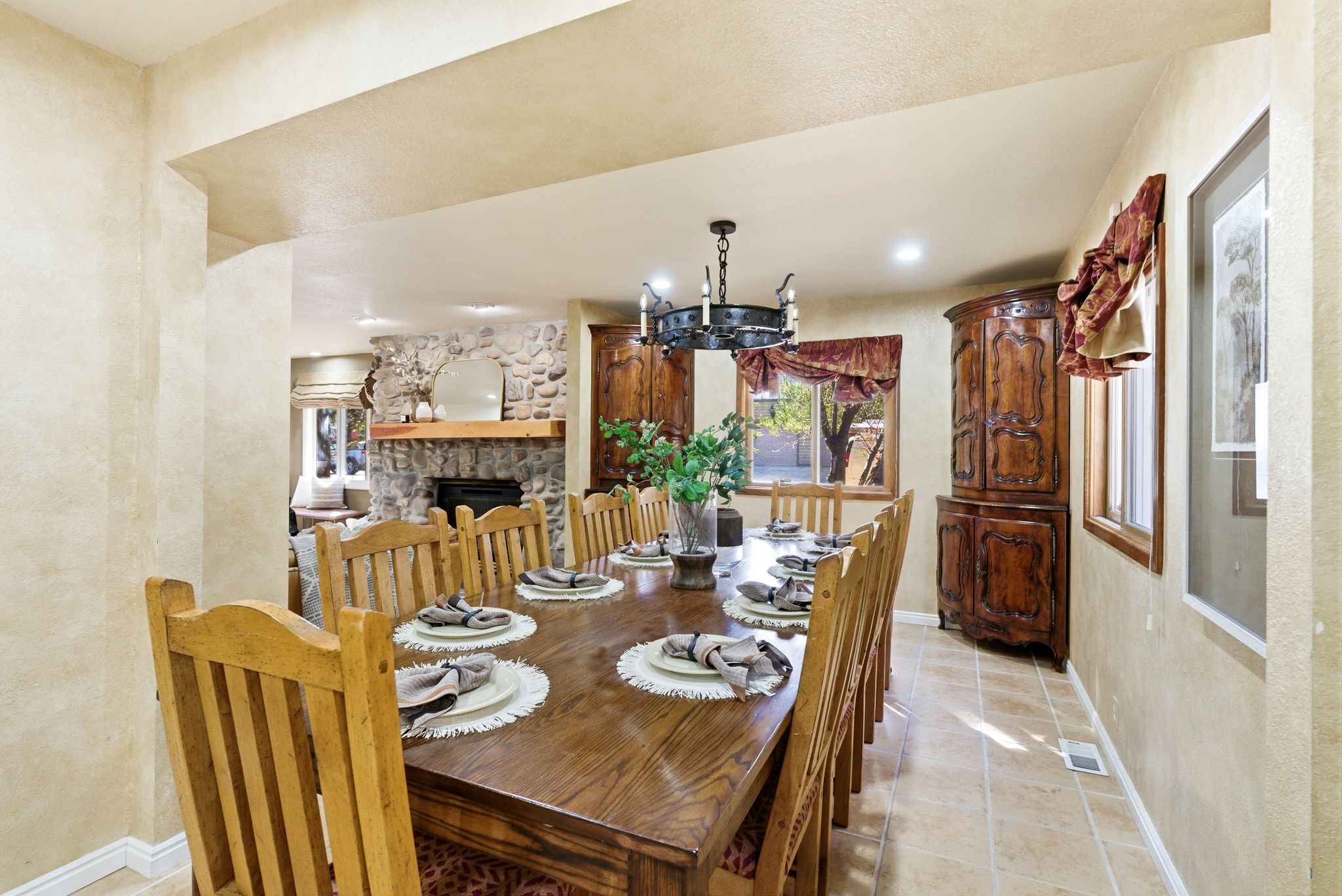 Spacious dining area featuring wood-finish flooring, a chandelier, and recessed lighting
