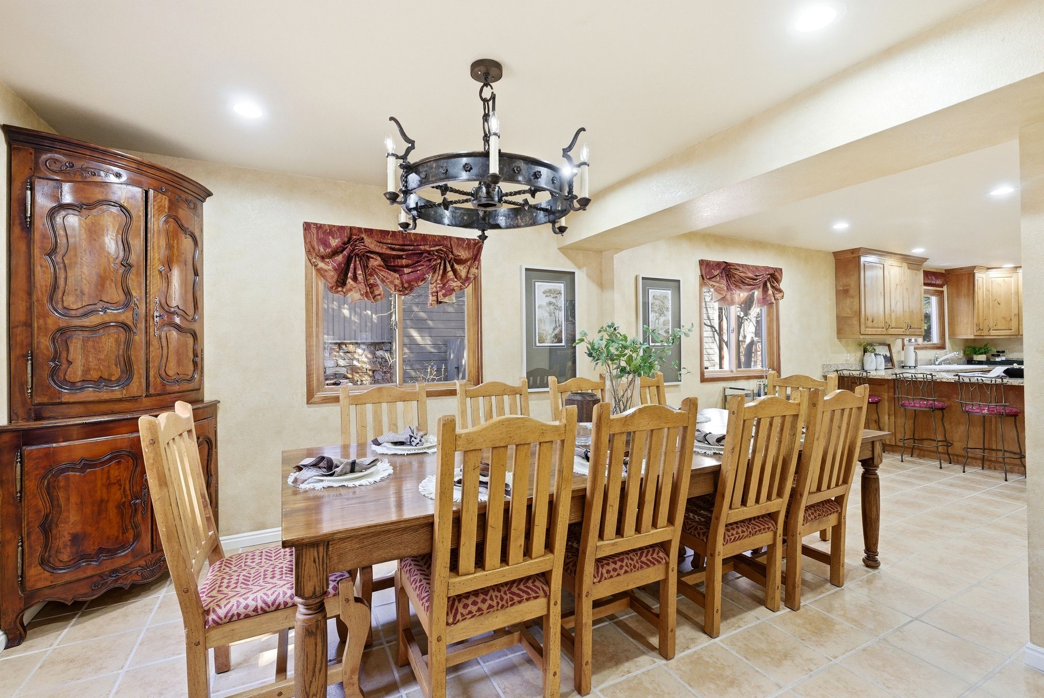 Dining area featuring tile flooring, recessed lighting, and a chandelier
