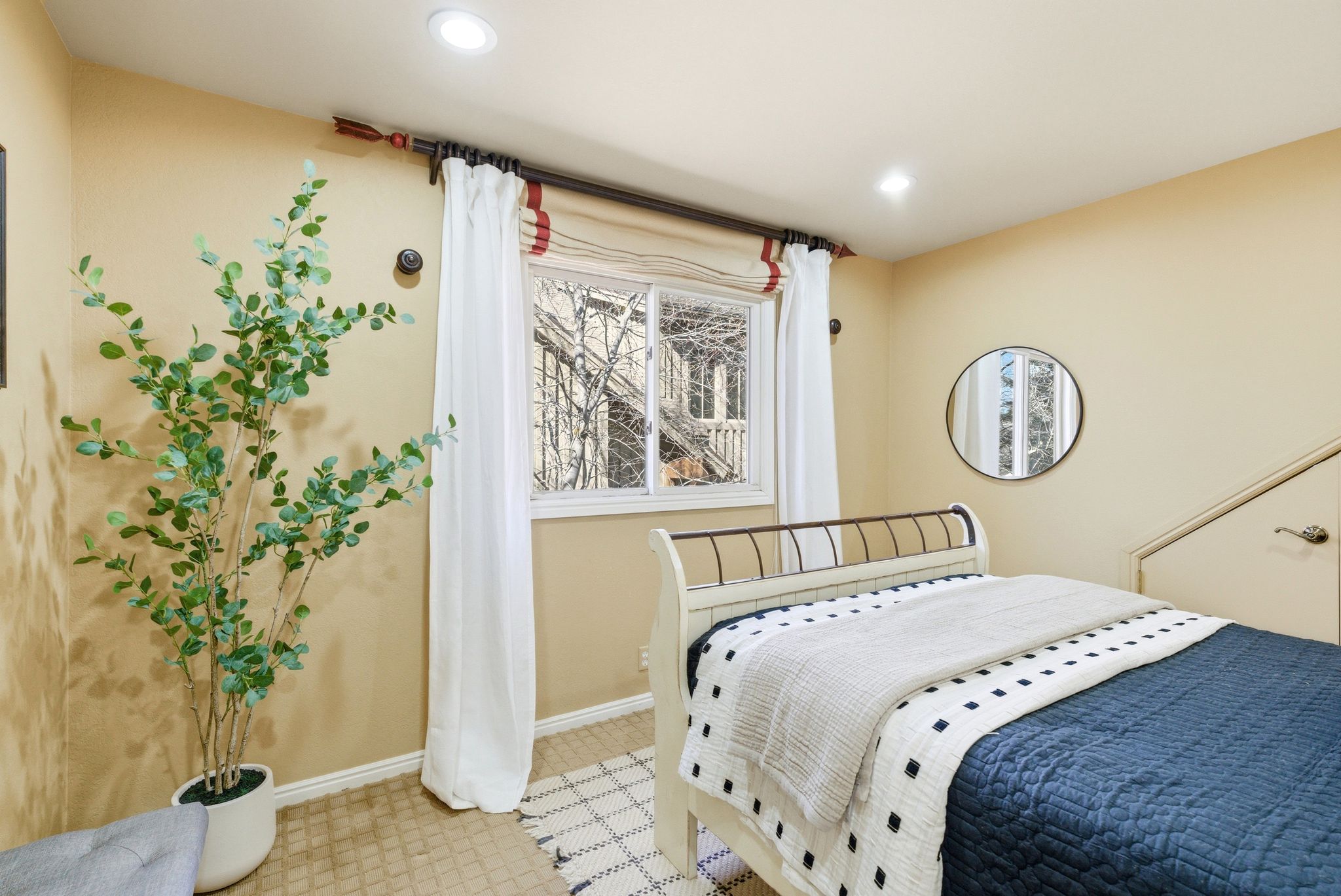 Recessed lighting illuminates neutral-toned walls