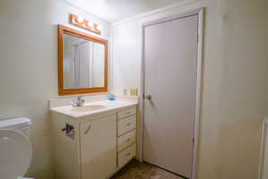 Vanity with an integrated sink and laminate countertop
