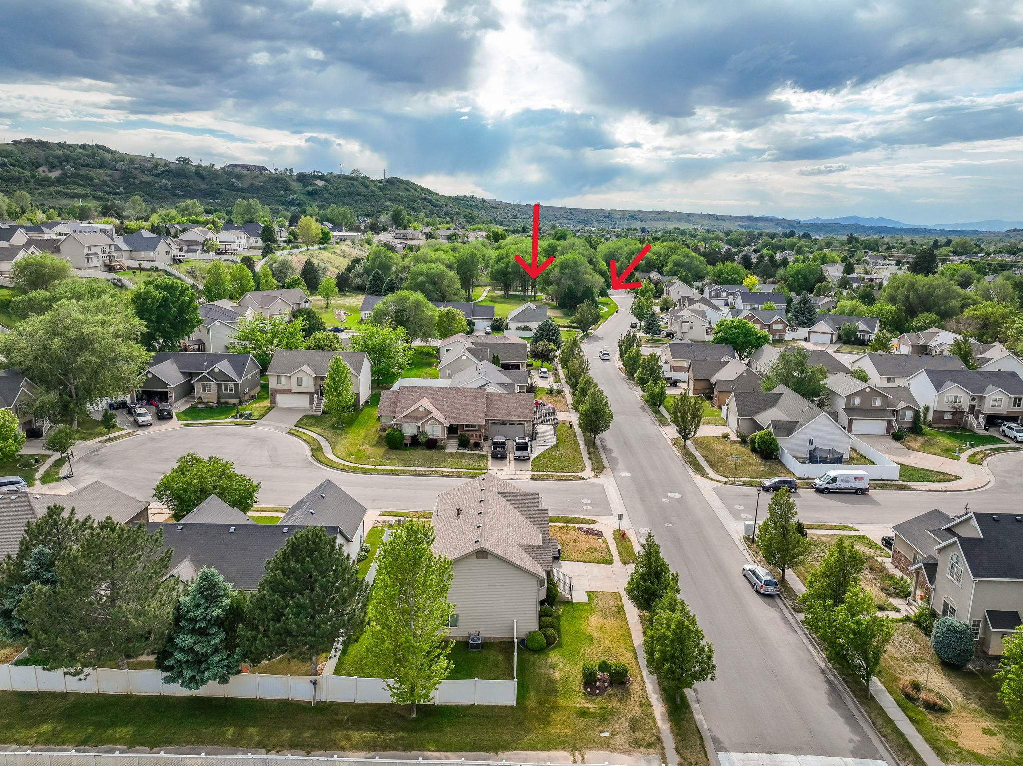 Aerial perspective showcasing a residential neighborhood with varied architectural styles and mature landscaping