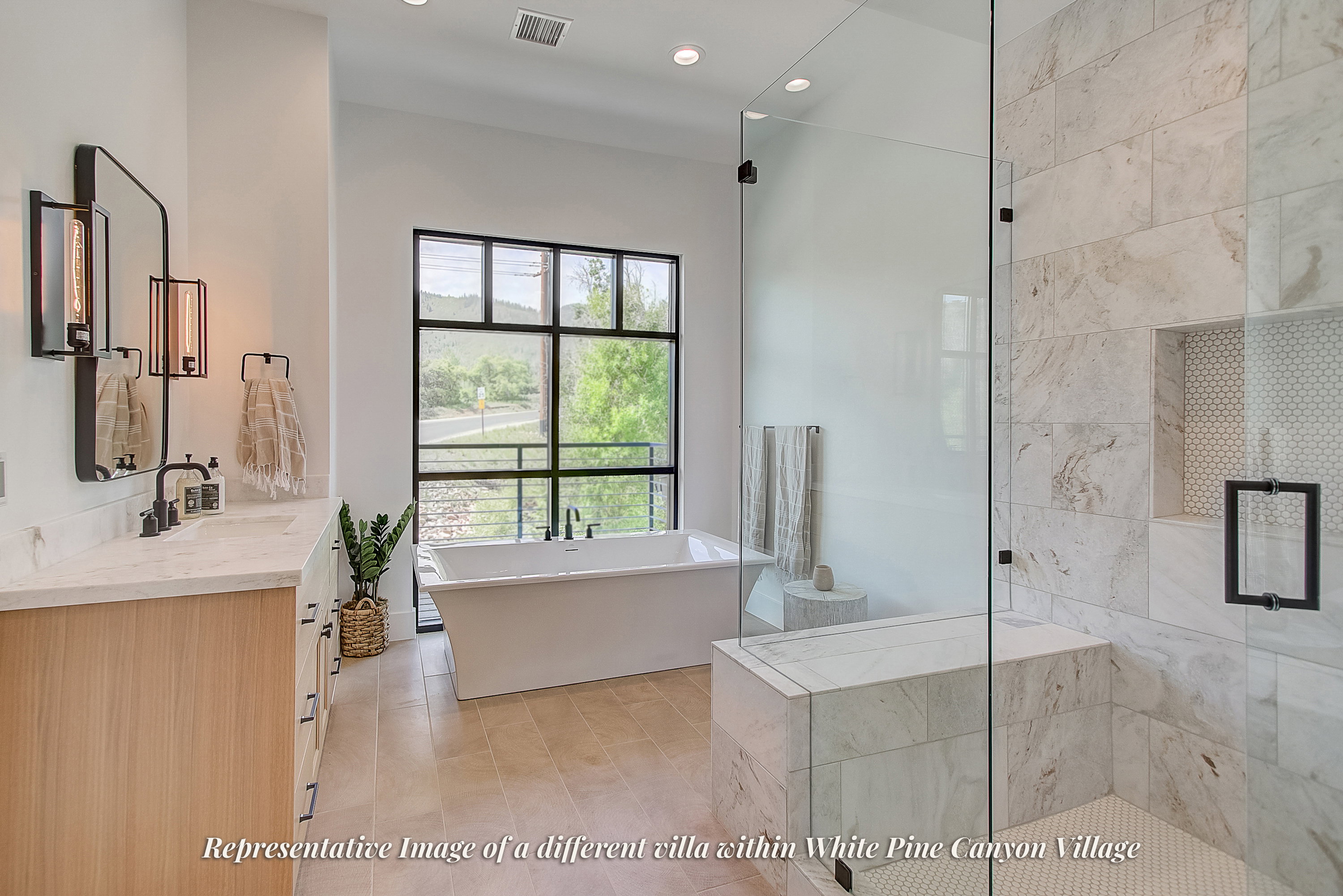Contemporary bathroom featuring a freestanding soaking tub, expansive window with black framing, wood-finish flooring, a double vanity with stone countertops, and a glass-enclosed shower with a built-in bench
