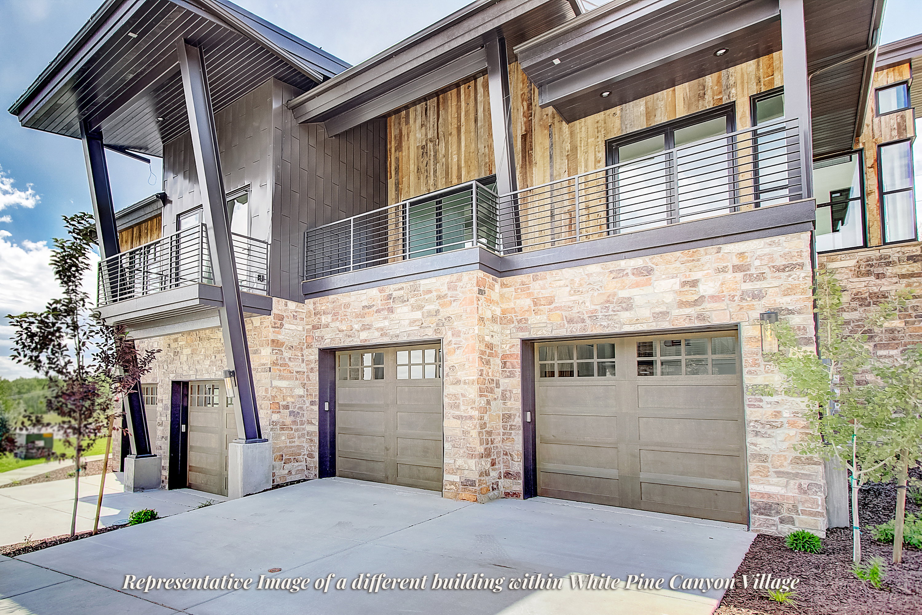 Modern tri-level exterior with a stone facade