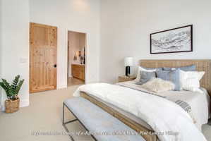 Light-colored carpeting complements crisp white walls