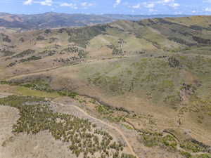 Expansive mountain terrain with varied topography and natural vegetation