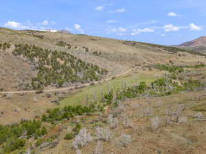 Expansive landscape featuring rolling hills and diverse terrain