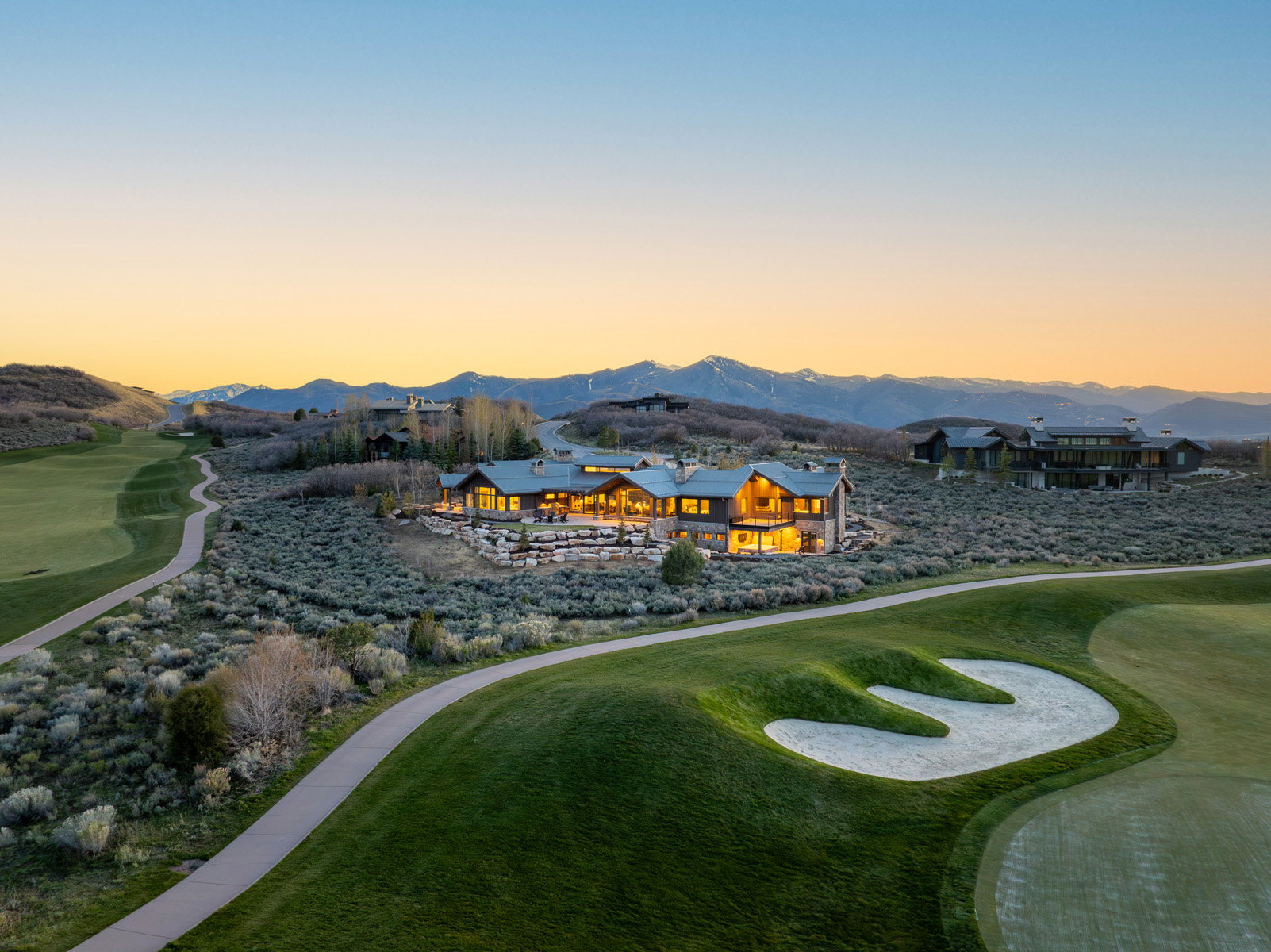 Expansive golf course property featuring a modern architectural residence