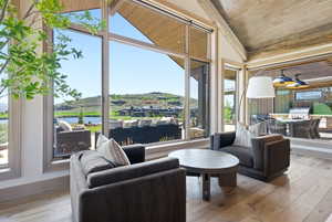 Expansive window wall with mountain and water scenery