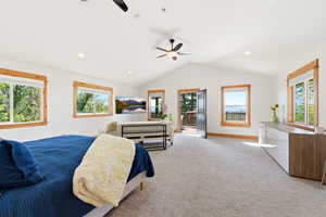 Vaulted ceiling room featuring light-colored carpet flooring, recessed lighting, and a ceiling fan