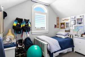 Arched window with plantation shutters provides natural illumination