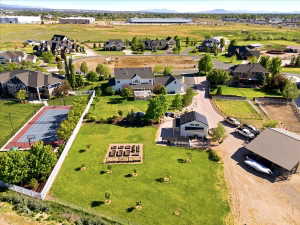 Expansive property featuring a private, raised garden beds, a contemporary barn-style outbuilding, and ample open green space
