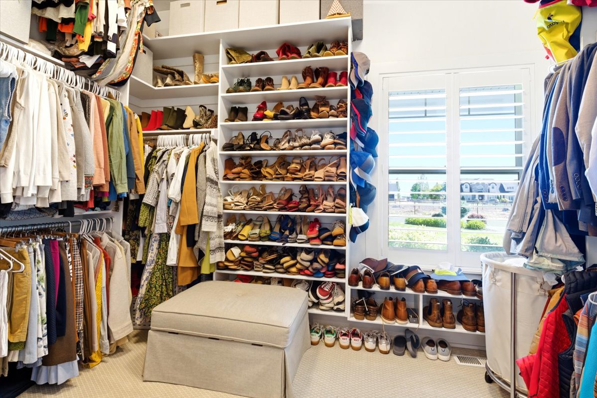 Custom closet system featuring extensive shelving