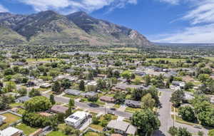 Aerial perspective showcasing a residential neighborhood with a prominent mountain backdrop