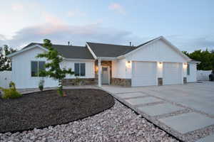 White board-and-batten exterior with stone veneer accents