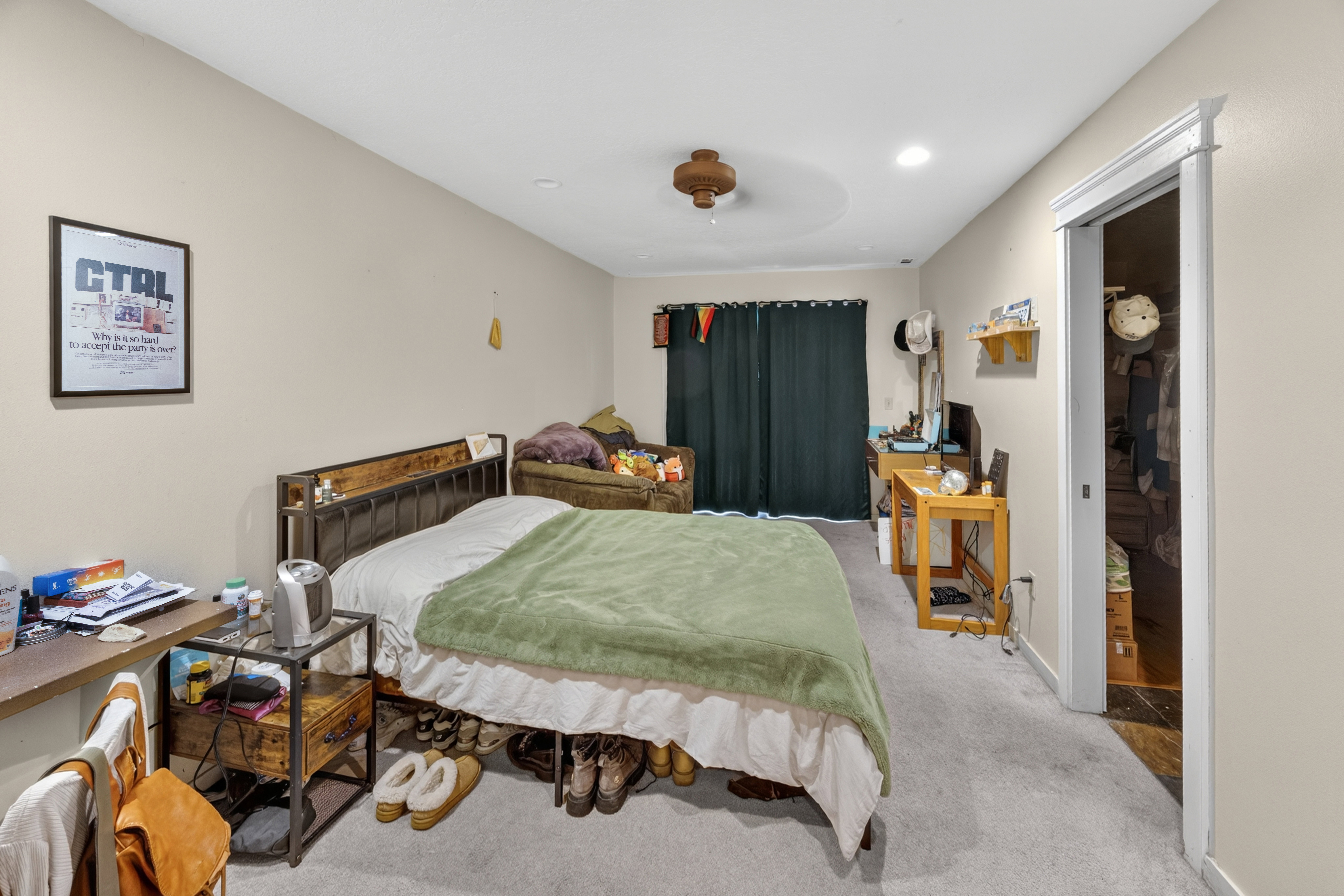 Carpeted room with light neutral wall paint