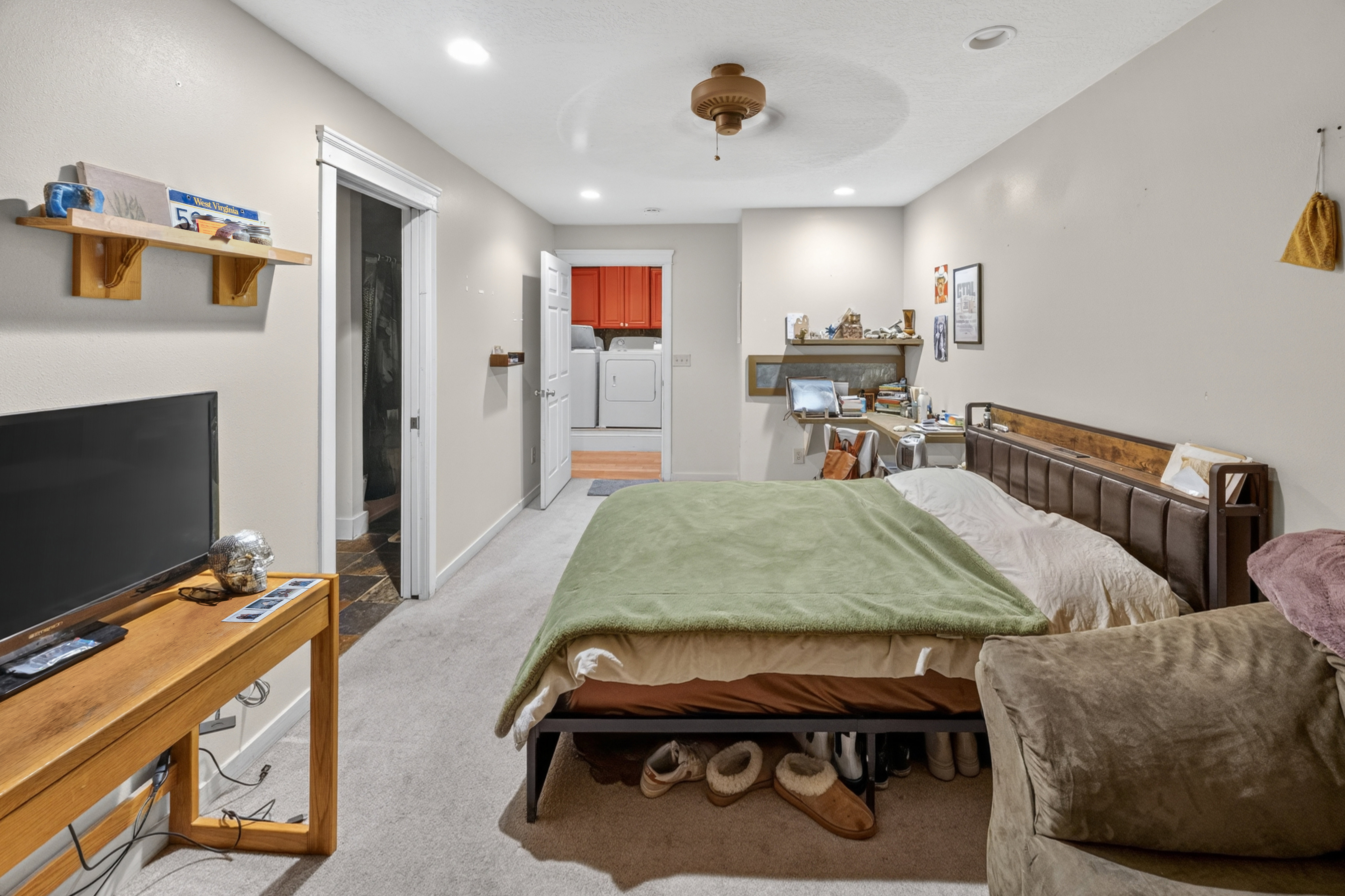 Carpeted interior space featuring recessed lighting and a ceiling fan