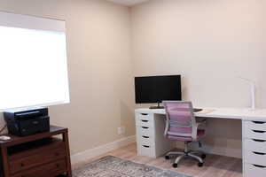 3rd floor bedroom currently being used as office/flex space. Mini split system to keep the temperature just right!