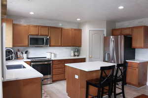 Check out this updated kitchen! The pictures do not do it justice! Extra cabinet lighting, subway tile backsplash, Quartz countertops.