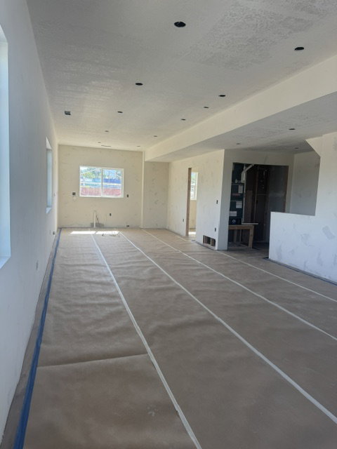 Expansive interior space.  Kitchen, dining, living room. Featuring recessed lighting and multiple windows