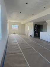 Expansive interior space.  Kitchen, dining, living room. Featuring recessed lighting and multiple windows