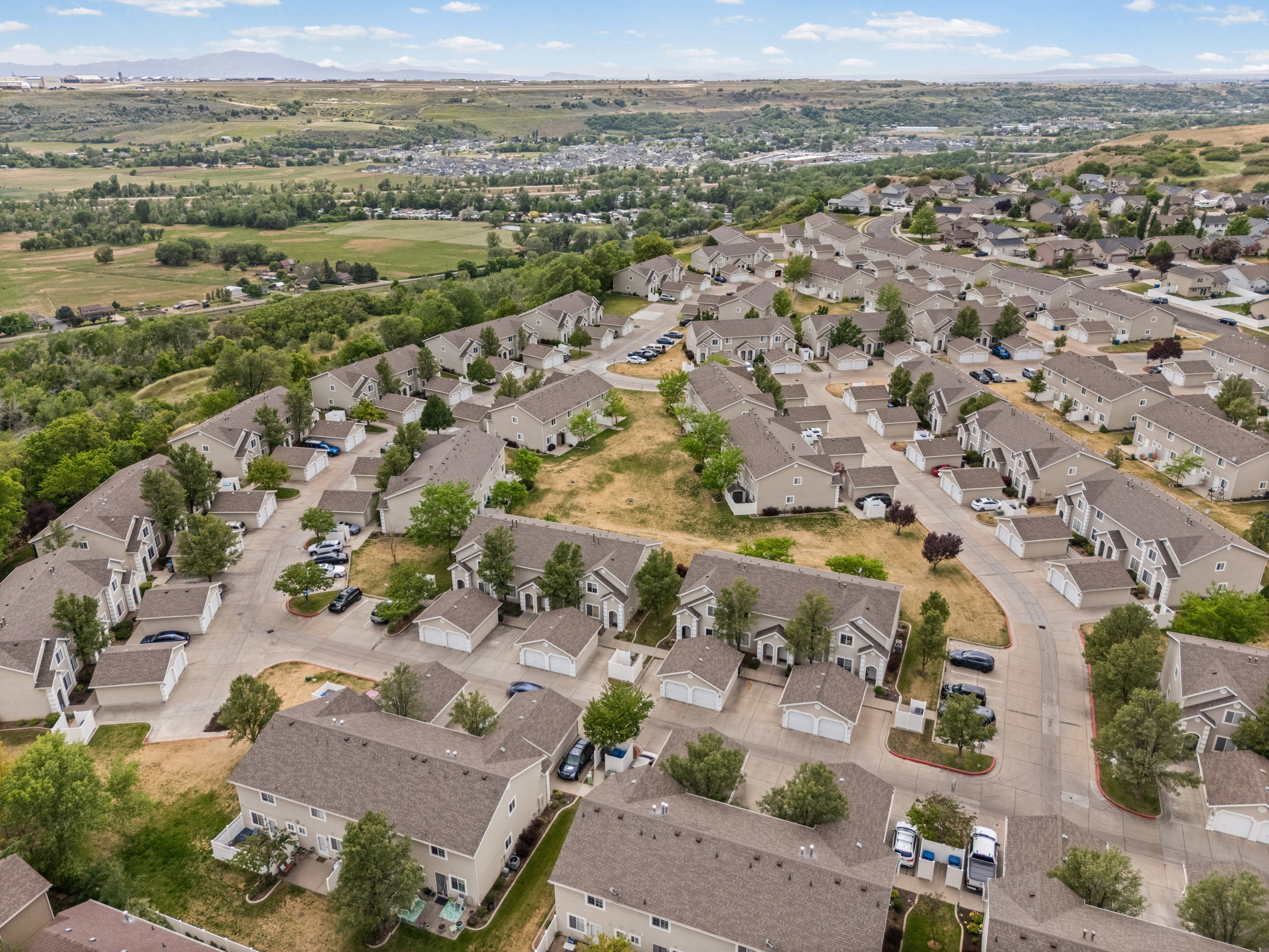 Residential community featuring multiple townhouse-style properties, each with individual garages