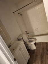 Bathroom featuring a white vanity with cabinet storage, chrome faucet, and a large mirror
