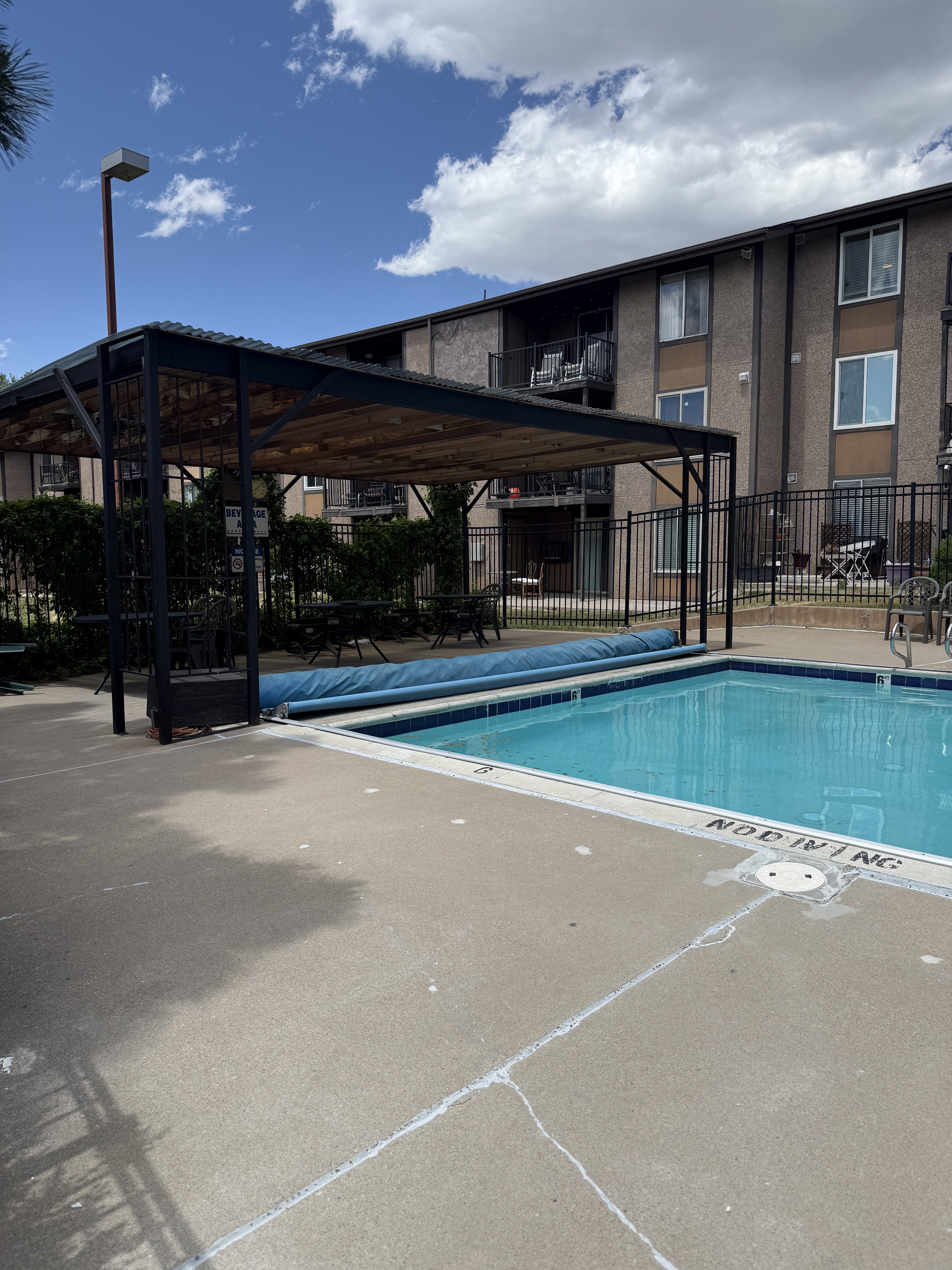 Outdoor swimming pool with surrounding concrete patio