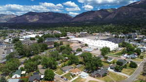 Aerial perspective showcasing a mixed-use area with residential structures and commercial buildings