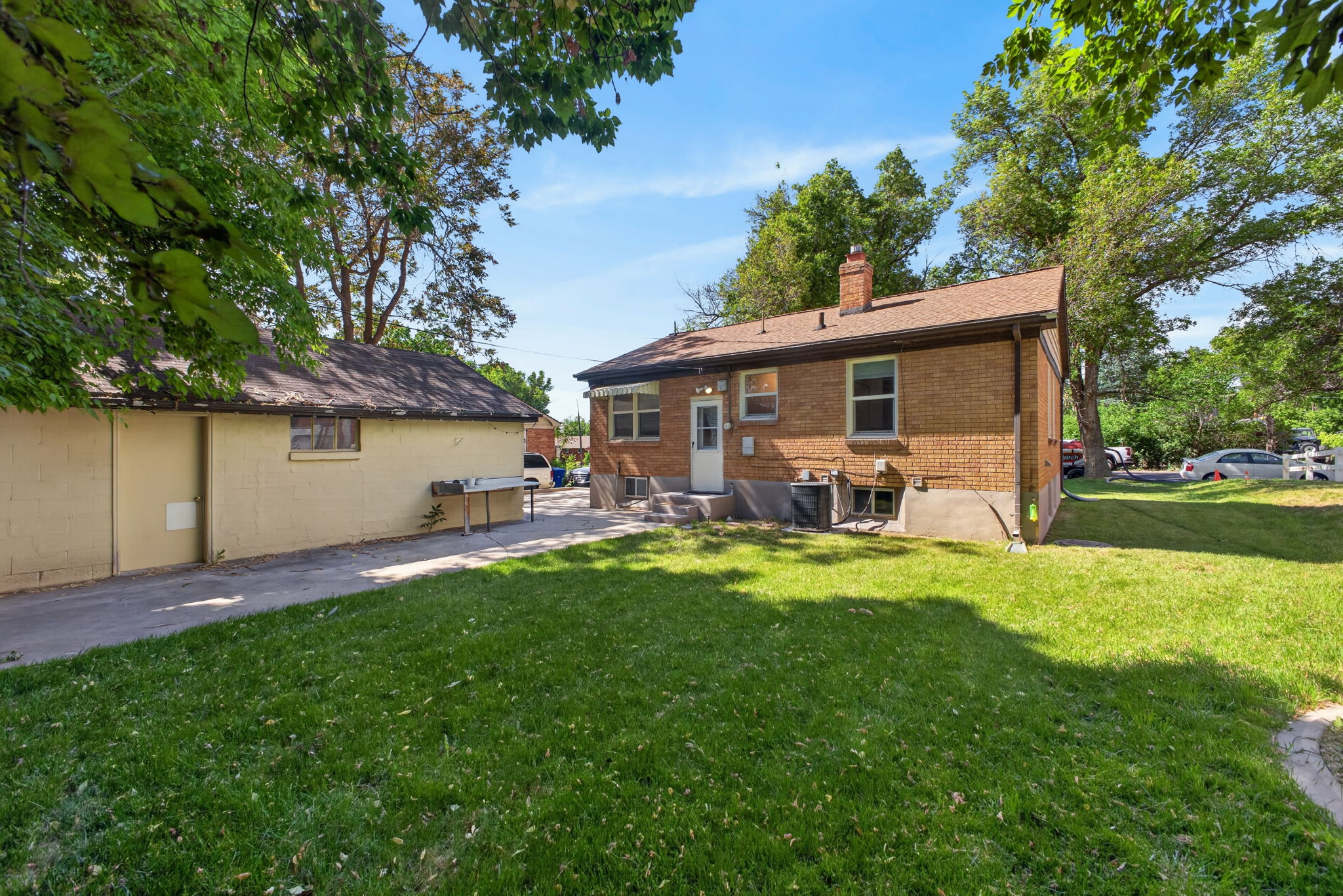 Nice shady back yard with patio.